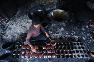 A woman prepares sugar in a traditional process in Puncak Lawang village in Bukittinggi, West Sumatra - an area known for its sugarcane. Photo: Udey Ismail 